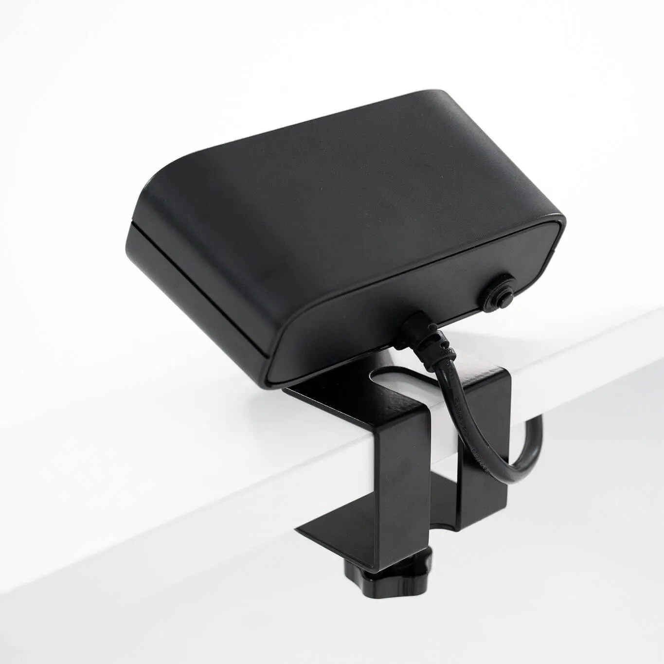LeetDesk PowerFlak clamp-on power socket with sleek design and easy mounting on desk.