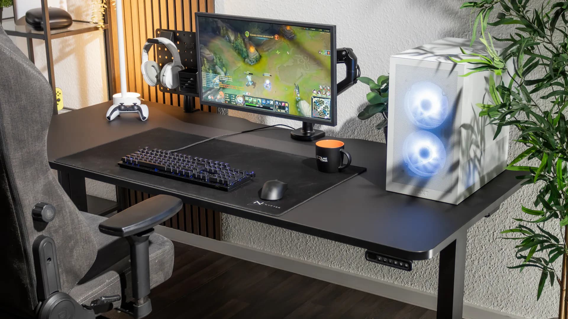 black gaming setup with leetdesk pro standing desk and accessories