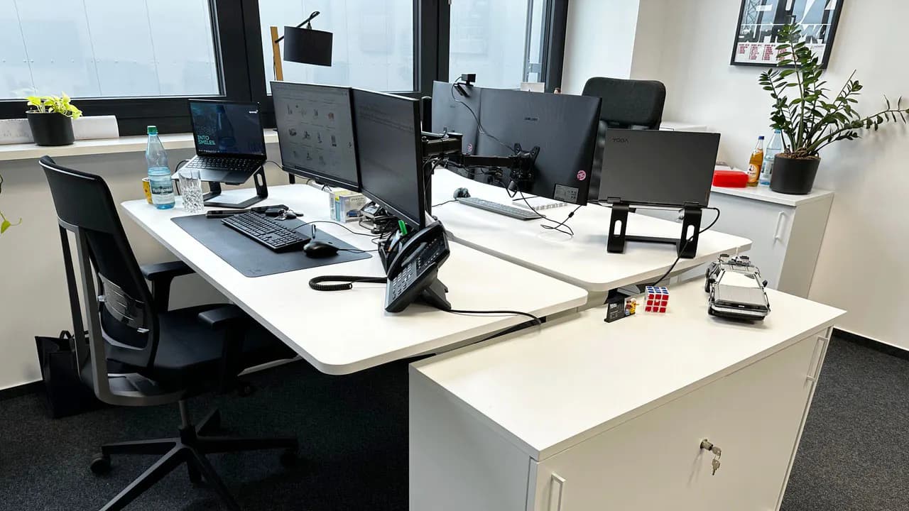 White height-adjustable office desks from LeetDesk in the office